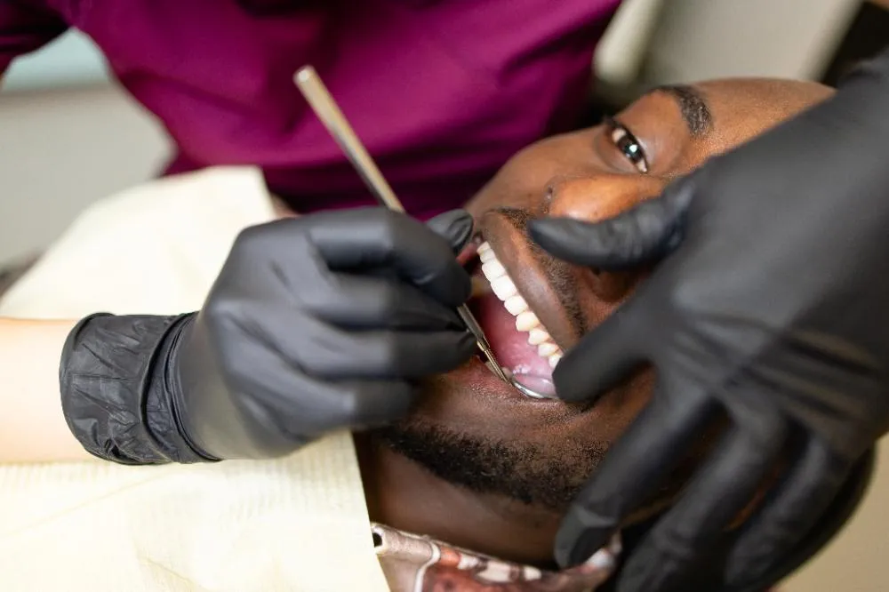 doctor treats patients teeth in a modern dental clinic