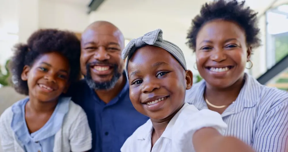 home selfie of a balck family smiling